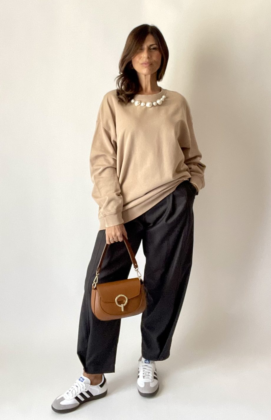 Borsa vera pelle con anello dorato